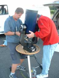 Carefully securing Bill's reflector telescope.